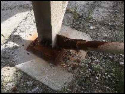 Steel structure safety - Corrosion on the footing of the building structure and cross bracing.