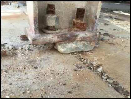 Cracked grout and loose bolts on supporting structure. - steel structural safety